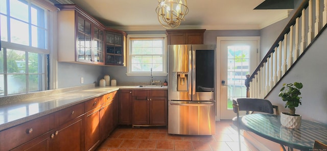 97 Waterbury Ave, Stamford, CT 06902 - kitchen featuring stainless steel fridge, a sink, glass insert cabinets, a chandelier, and tile patterned floors