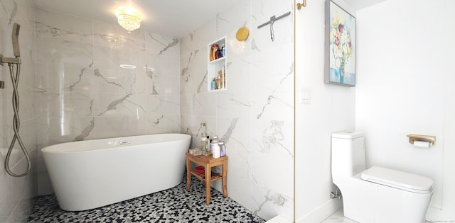 97 Waterbury Ave, Stamford, CT 06902 - bathroom featuring tile walls, a freestanding bath, and toilet