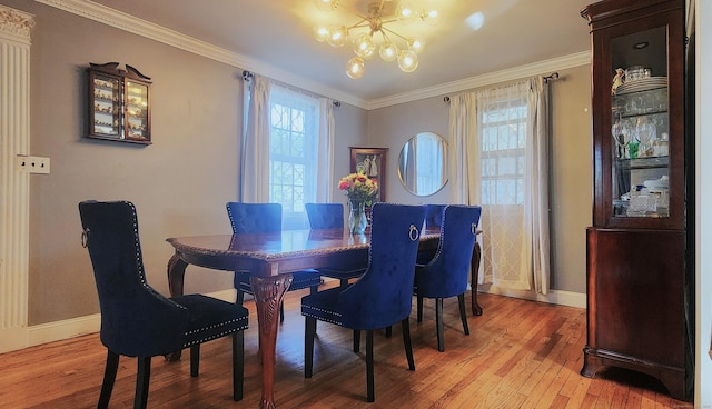 97 Waterbury Ave, Stamford, CT 06902 - dining space with a chandelier, light wood-type flooring, healthy amount of natural light, and crown molding