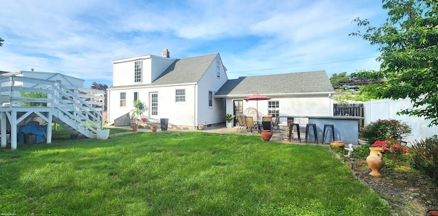 97 Waterbury Ave, Stamford, CT 06902 - rear view of house featuring a patio, a shingled roof, a wooden deck, and a chimney