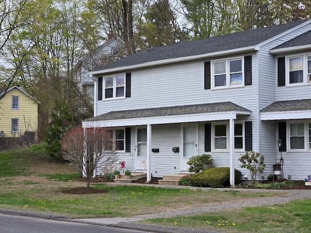 71 Arthur St Apt 2, Torrington, CT 06790 - view of front of house featuring covered porch and a front yard