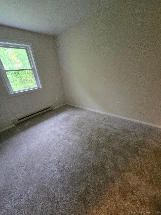 71 Arthur St Apt 2, Torrington, CT 06790 - carpeted empty room with baseboard heating and baseboards