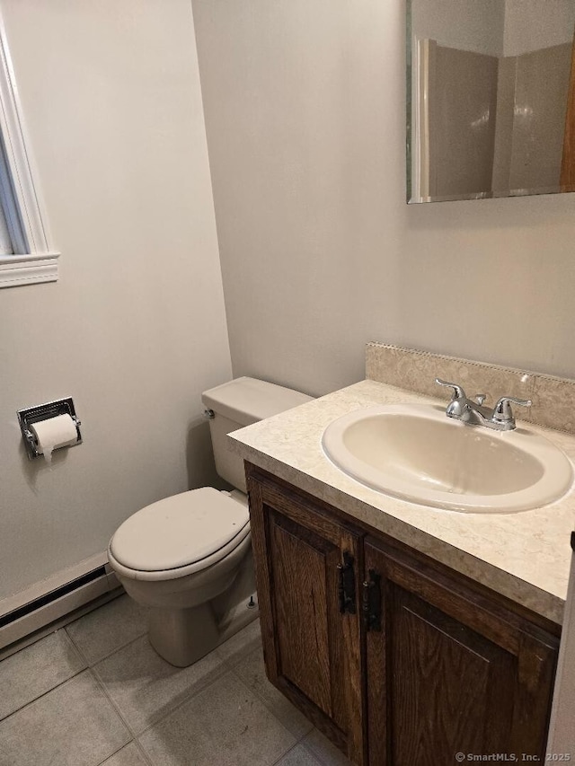 71 Arthur St Apt 2, Torrington, CT 06790 - bathroom featuring toilet, vanity, tile patterned flooring, and a baseboard heating unit