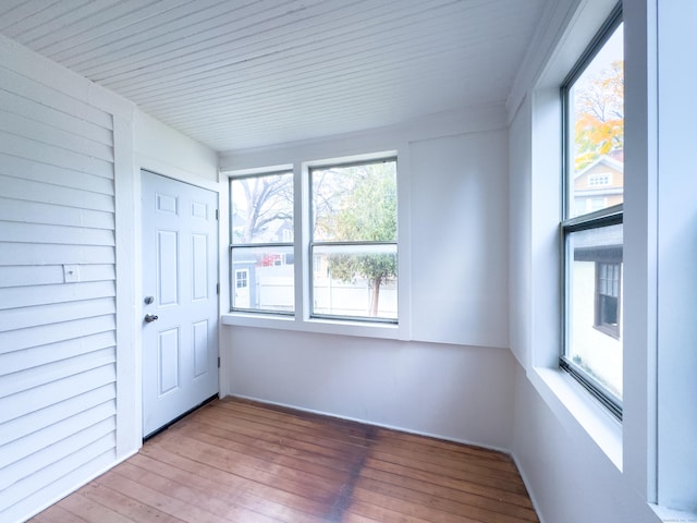 interior space featuring wood-type flooring and wooden ceiling