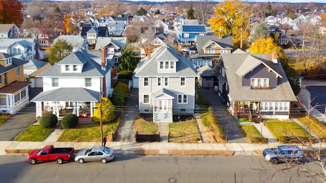 birds eye view of property with a residential view