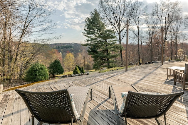wooden terrace featuring outdoor dining area