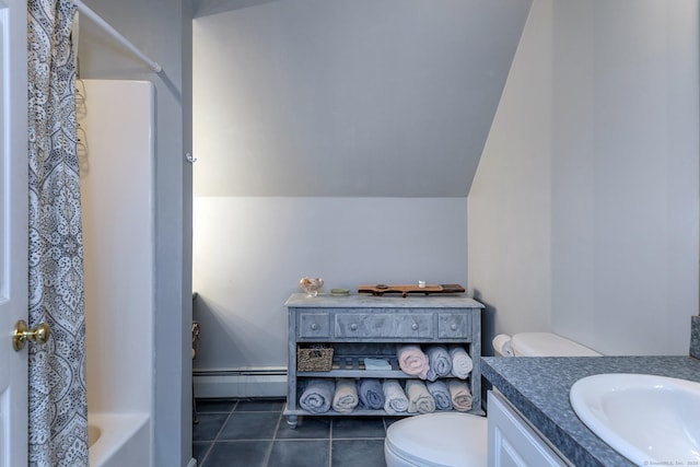 full bathroom with a baseboard heating unit, vanity, tile patterned floors, toilet, and lofted ceiling