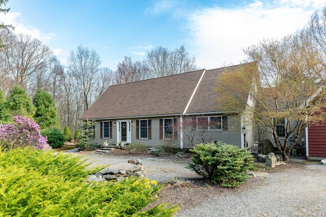 view of front of property featuring roof with shingles