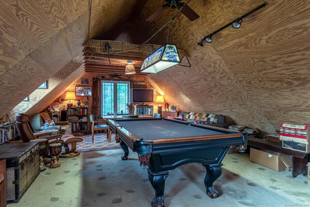 rec room with a ceiling fan, vaulted ceiling, and pool table