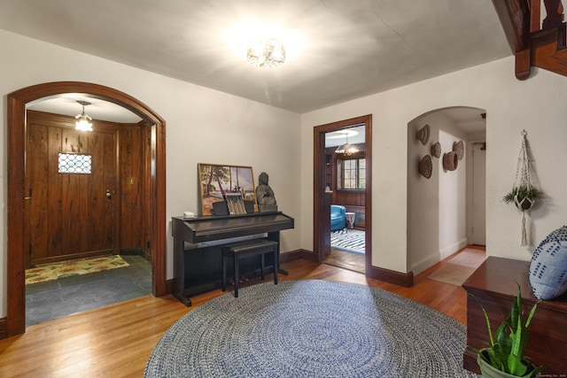 386 Bloomfield Ave, West Hartford, CT 06117 - entryway featuring arched walkways, wood finished floors, and baseboards