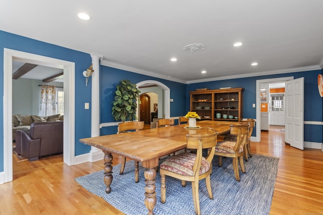 386 Bloomfield Ave, West Hartford, CT 06117 - dining room with crown molding, arched walkways, light wood-style flooring, baseboards, and recessed lighting