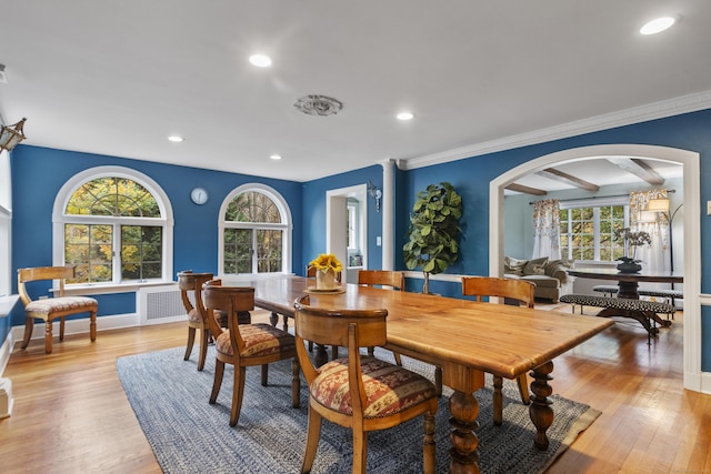 386 Bloomfield Ave, West Hartford, CT 06117 - dining room with arched walkways, ornamental molding, light wood finished floors, and recessed lighting