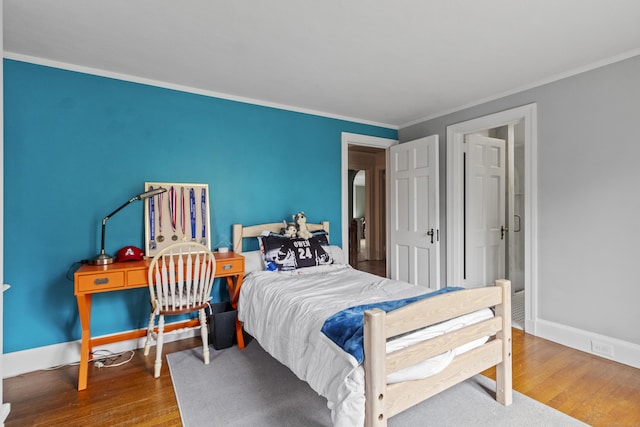 386 Bloomfield Ave, West Hartford, CT 06117 - bedroom with wood finished floors, crown molding, and baseboards