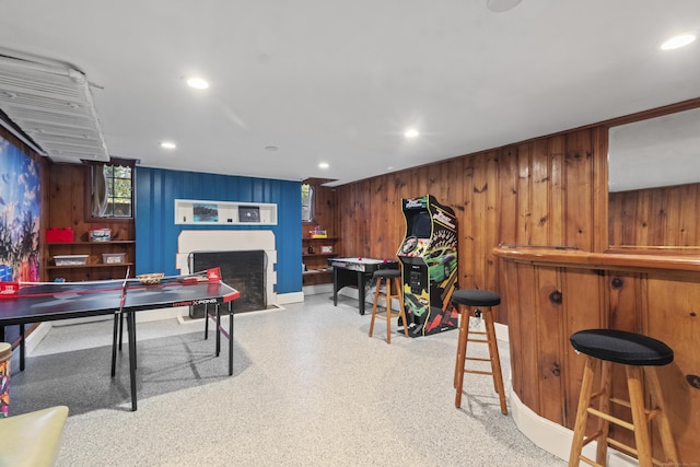 386 Bloomfield Ave, West Hartford, CT 06117 - playroom with a fireplace with flush hearth, wooden walls, and recessed lighting