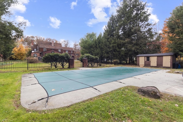 386 Bloomfield Ave, West Hartford, CT 06117 - view of pool featuring a fenced in pool, fence, a patio area, an outdoor structure, and a lawn