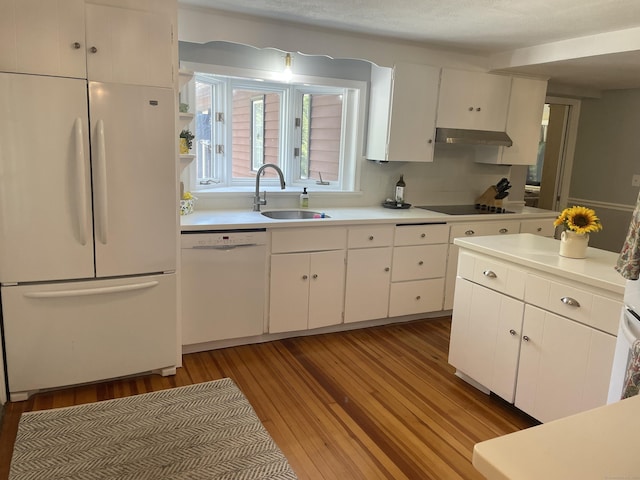 386 Bloomfield Ave, West Hartford, CT 06117 - kitchen with a sink, white appliances, white cabinetry, light countertops, and under cabinet range hood