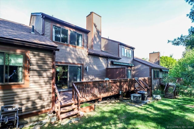 61 Wickhams Fancy Unit 61, Canton, CT 06019 - back of property with a chimney, a deck, a lawn, roof with shingles, and stairs
