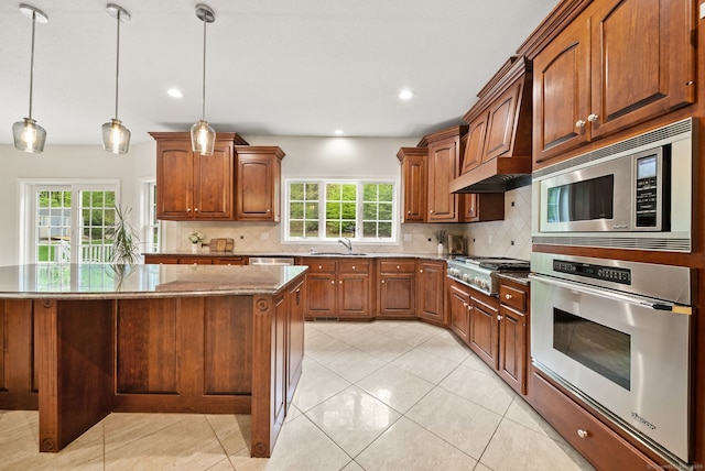420 Winding Rdg, Southington, CT 06489 - kitchen with appliances with stainless steel finishes, a sink, dark stone countertops, backsplash, and recessed lighting
