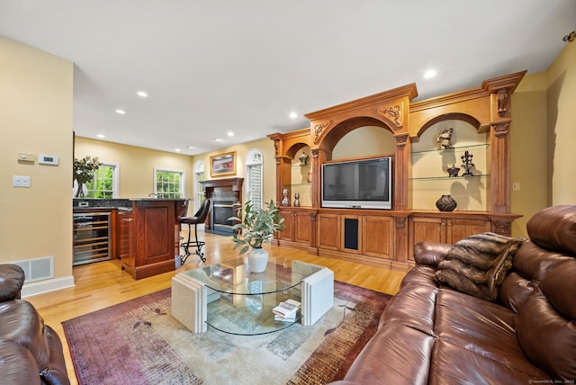420 Winding Rdg, Southington, CT 06489 - living room with wine cooler, light wood-type flooring, recessed lighting, and a fireplace