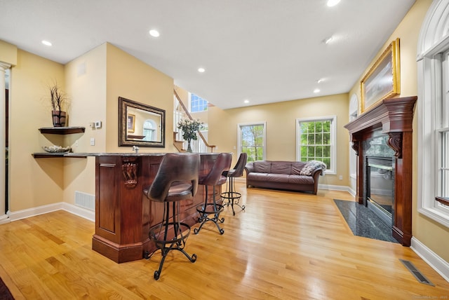 420 Winding Rdg, Southington, CT 06489 - bar area featuring a fireplace, light wood-style flooring, baseboards, recessed lighting, and stairway