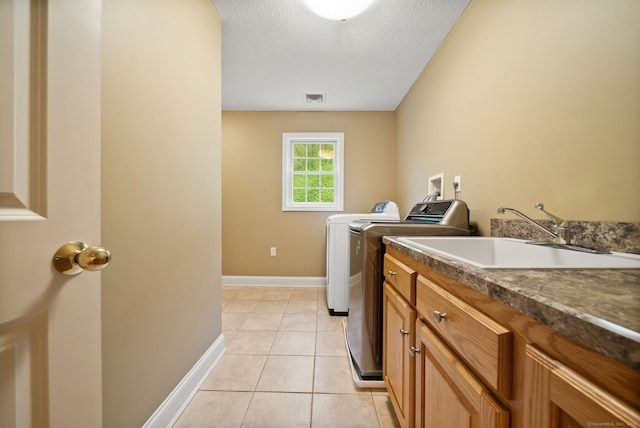 420 Winding Rdg, Southington, CT 06489 - washroom with washing machine and dryer, light tile patterned floors, cabinet space, baseboards, and a textured ceiling
