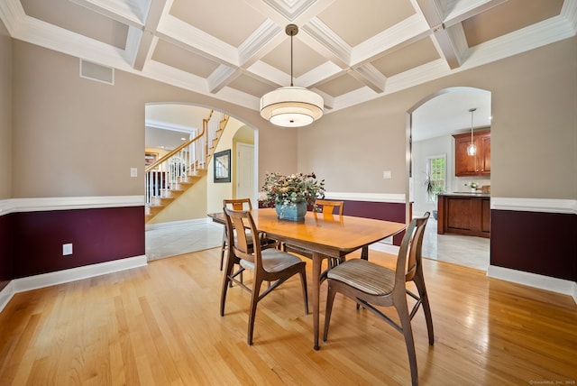 420 Winding Rdg, Southington, CT 06489 - dining area with arched walkways, coffered ceiling, light wood-style floors, beam ceiling, and stairway