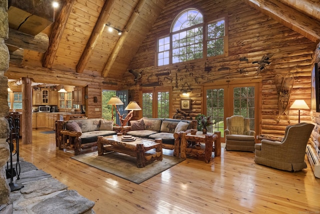 living area featuring light wood finished floors, french doors, beamed ceiling, wooden ceiling, and high vaulted ceiling