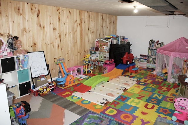 game room featuring wooden walls