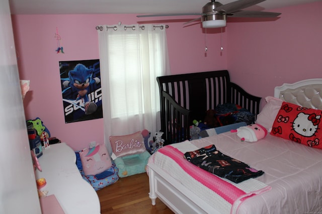 bedroom with ceiling fan and wood finished floors