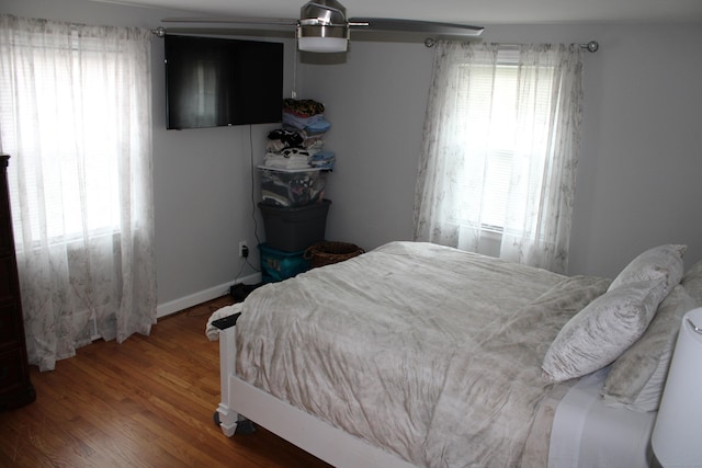bedroom with wood finished floors