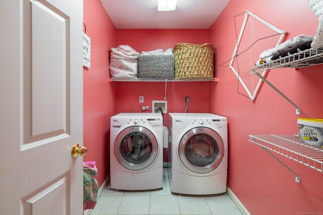 114 Cobbler Ln, Southbury, CT 06488 - clothes washing area with laundry area, baseboards, light tile patterned floors, and washing machine and clothes dryer