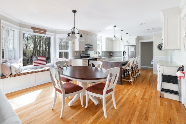 114 Cobbler Ln, Southbury, CT 06488 - dining room with crown molding, light wood-type flooring, and visible vents