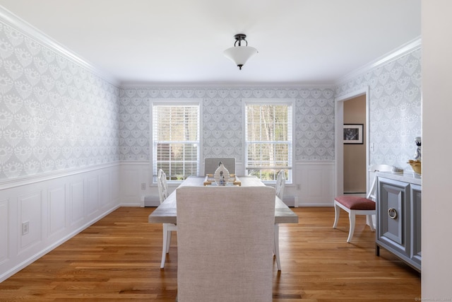 114 Cobbler Ln, Southbury, CT 06488 - dining area with crown molding, light wood-style flooring, wainscoting, and wallpapered walls