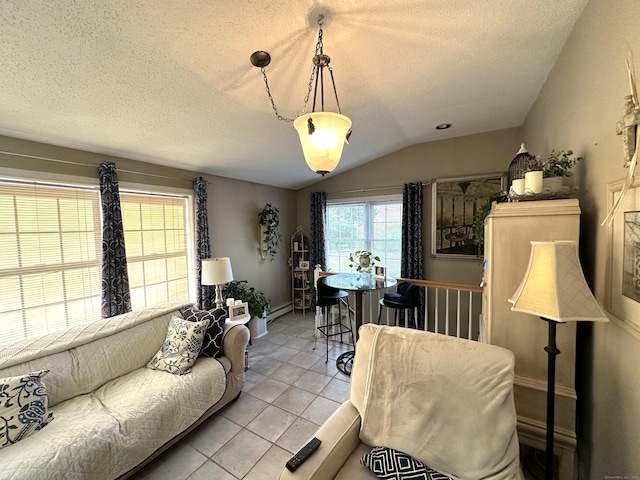 living room with baseboard heating, light tile patterned floors, a textured ceiling, and lofted ceiling