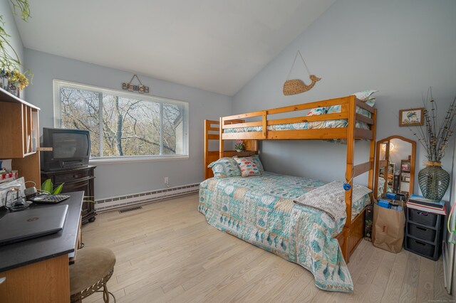 22 Harbour Vlg Unit A, Branford, CT 06405 - bedroom featuring baseboard heating, wood finished floors, and vaulted ceiling