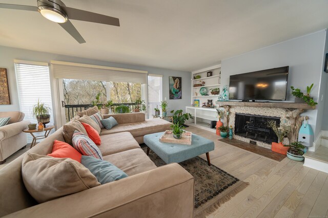 22 Harbour Vlg Unit A, Branford, CT 06405 - living room with wood finished floors, ceiling fan, and a high end fireplace