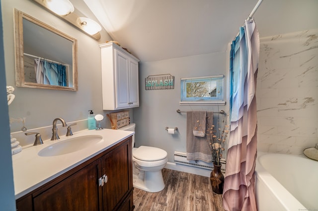 full bath featuring wood finished floors, vanity, a baseboard heating unit, toilet, and shower / tub combo with curtain