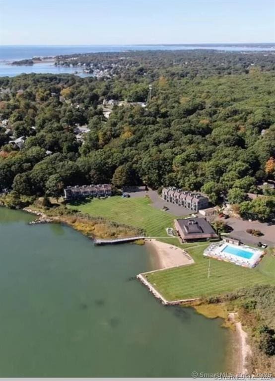 bird's eye view with a water view and a view of trees