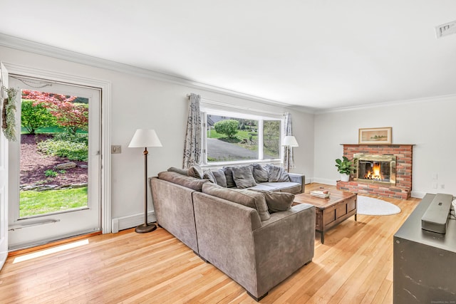 82 Village Dr, Shelton, CT 06484 - living area featuring light wood-style floors, crown molding, and a wealth of natural light