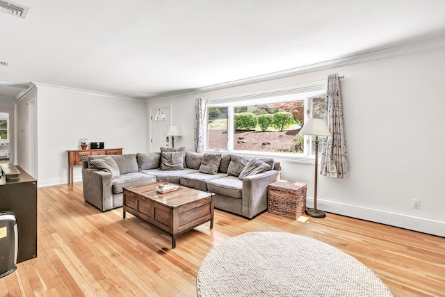 82 Village Dr, Shelton, CT 06484 - living room with crown molding, baseboards, light wood-type flooring, and visible vents