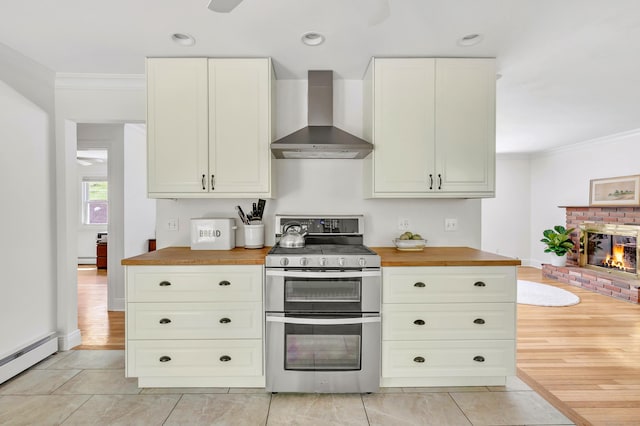 82 Village Dr, Shelton, CT 06484 - kitchen featuring baseboard heating, wood counters, wall chimney exhaust hood, double oven range, and ornamental molding