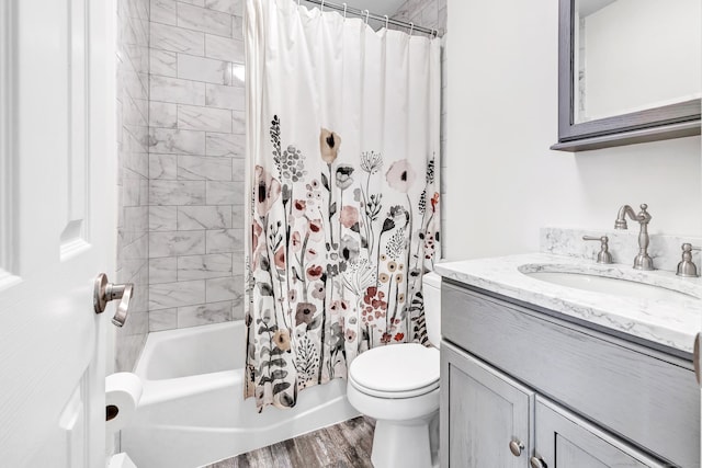 82 Village Dr, Shelton, CT 06484 - full bathroom featuring vanity, shower / bath combo with shower curtain, toilet, and wood finished floors