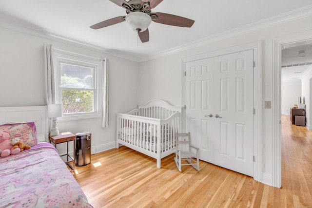 82 Village Dr, Shelton, CT 06484 - bedroom with ceiling fan, ornamental molding, a closet, and light wood-style flooring