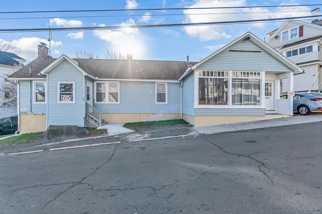 113 Bunker Hill Ave, Waterbury, CT 06708 - view of front of home with a shingled roof, a chimney, and entry steps