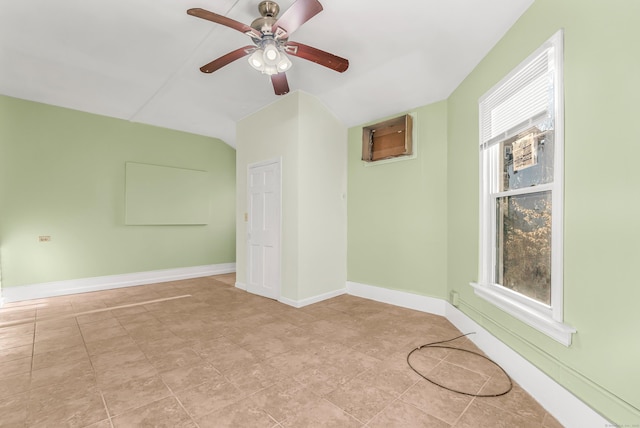 unfurnished room featuring a ceiling fan and baseboards