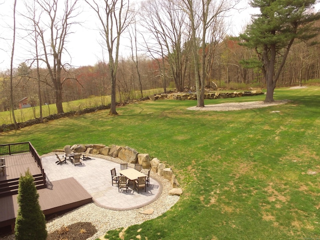 view of yard with a fire pit and a wooden deck