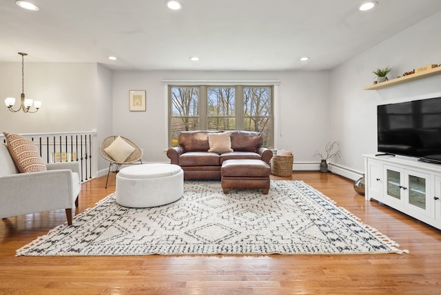 living area with an inviting chandelier and recessed lighting
