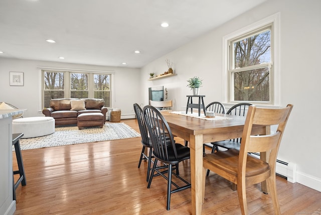 dining area featuring light wood-style floors and recessed lighting