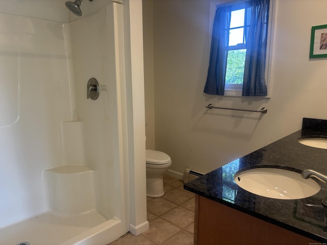 14 N Washington Ave, East Lyme, CT 06357 - full bath with tile patterned flooring, a baseboard radiator, a shower stall, and double vanity