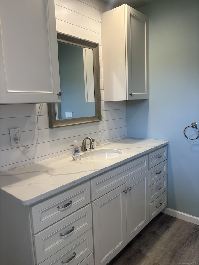 14 N Washington Ave, East Lyme, CT 06357 - bathroom with vanity, wood finished floors, and decorative backsplash